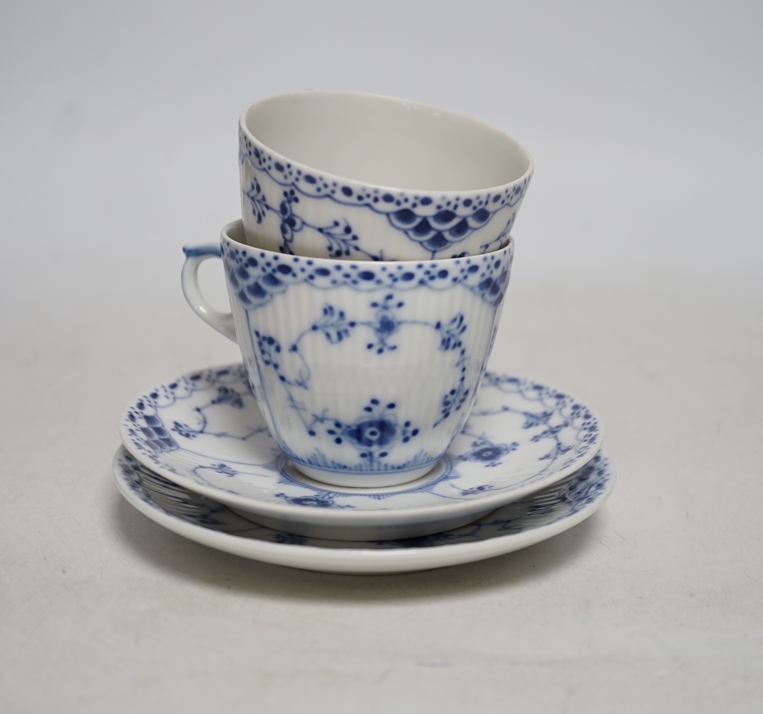 A Royal Copenhagen blue and white ‘onion pattern’ coffee and part set comprising; seven coffee cups with eight saucers, two teacup and saucers, and six tea plates together with a set of six similar Bavaria tea plates